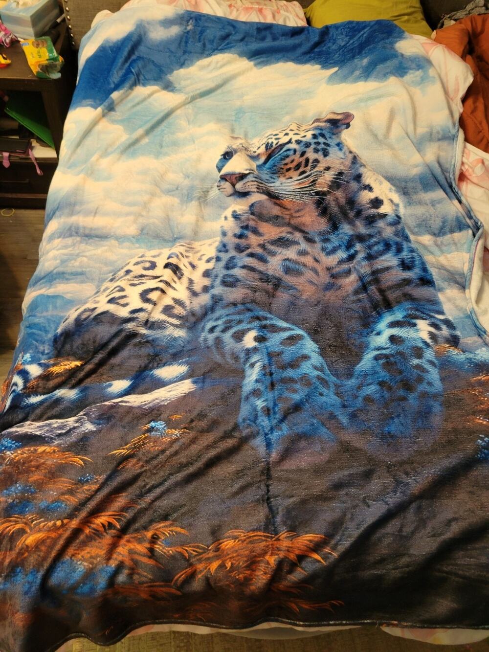 soft plush fleece throw blanket featuring a blue-toned snow leopard New